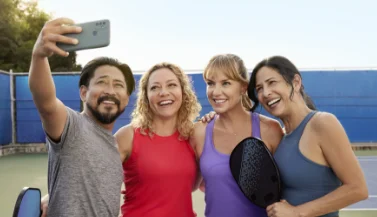 Bridget taking photo with friends
