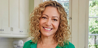 Photo of TEPEZZA patient, Bridget, in her kitchen